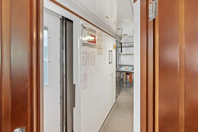 Slide: The Image of Interior view of 2008 Benetti Classic yacht, featuring hallway and dining area. - 91