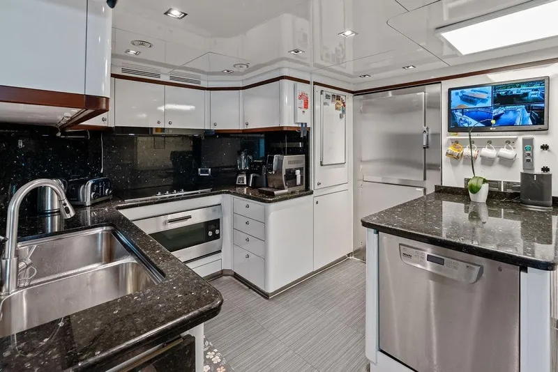 Slide: The Image of Luxurious kitchen interior on a 2008 Benetti Classic yacht, featuring modern appliances and sleek design. - 94