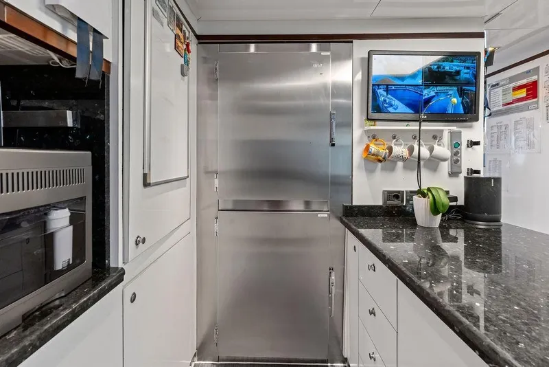 Slide: The Image of Kitchen area of a 2008 Benetti Classic yacht with modern appliances. - 95