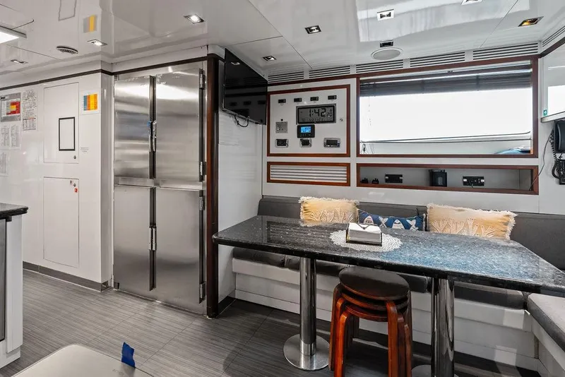 Slide: The Image of Luxurious interior of 2008 Benetti Classic yacht with modern dining area and sleek design. - 98