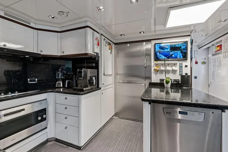 Slide: The Image of Luxurious kitchen interior on a 2008 Benetti Classic yacht, featuring modern appliances and sleek design. - 99