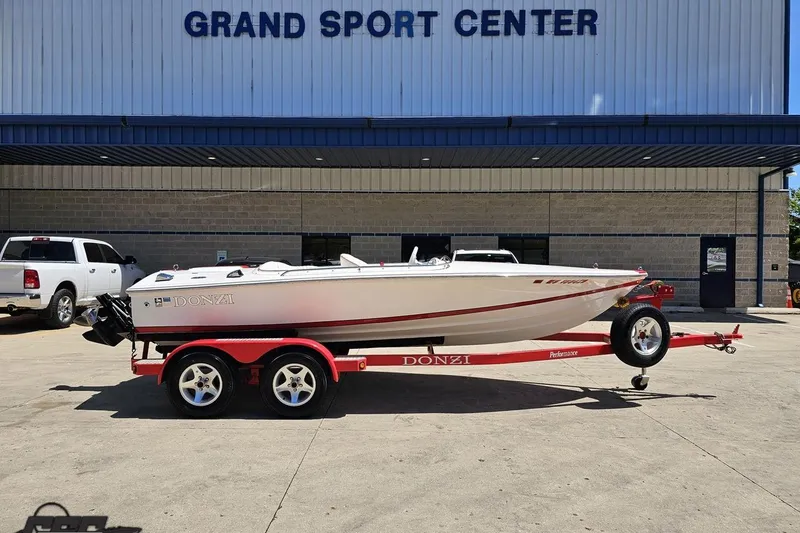 The Image of 1997 Donzi 18 Classic boat on red trailer at Grand Sport Center. - 1