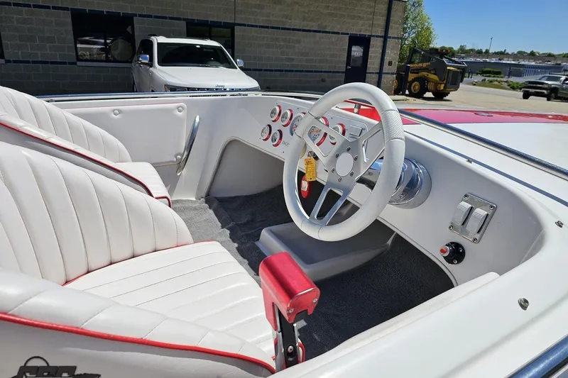 Slide: The Image of Interior of a 1997 Donzi 18 Classic boat with white and red seating. - 11