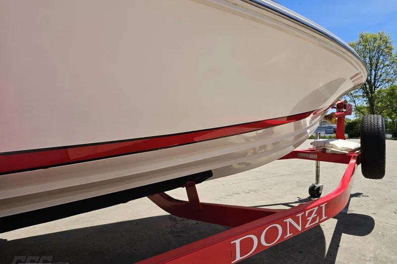 Slide: The Image of 1997 Donzi 18 Classic boat on red trailer, side view. - 15