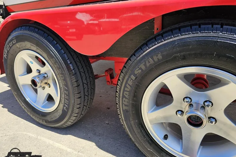Slide: The Image of Trailer wheels of a 1997 Donzi 18 Classic boat, featuring Travelstar tires. - 17