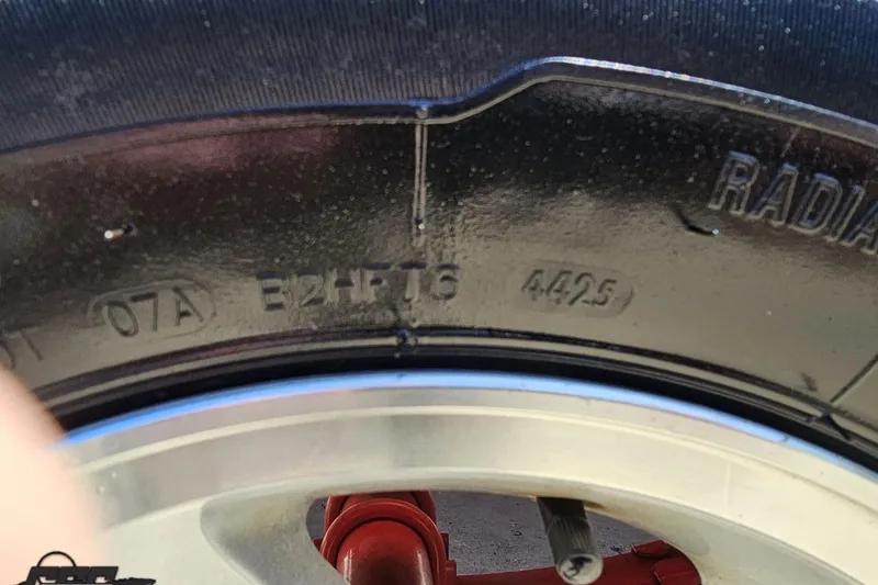 Slide: The Image of Close-up of a tire on a 1997 Donzi 18 Classic boat trailer. - 20
