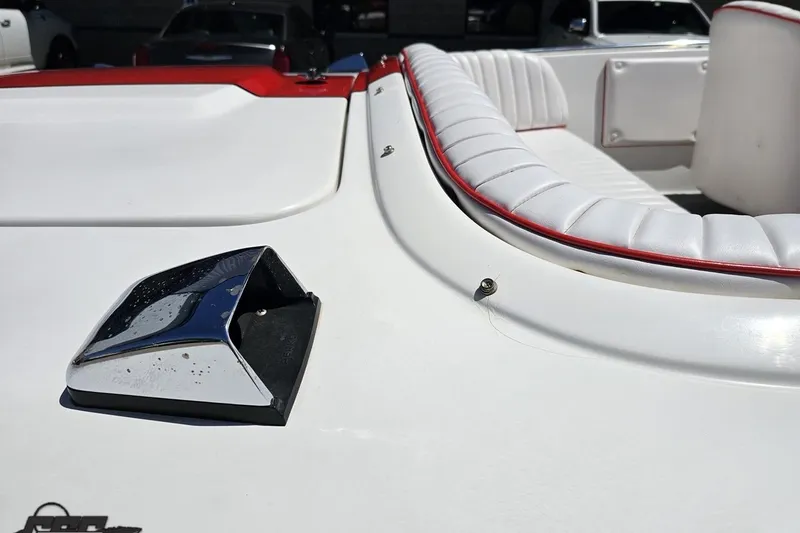Slide: The Image of 1997 Donzi 18 Classic boat interior with white and red seating detail. - 21