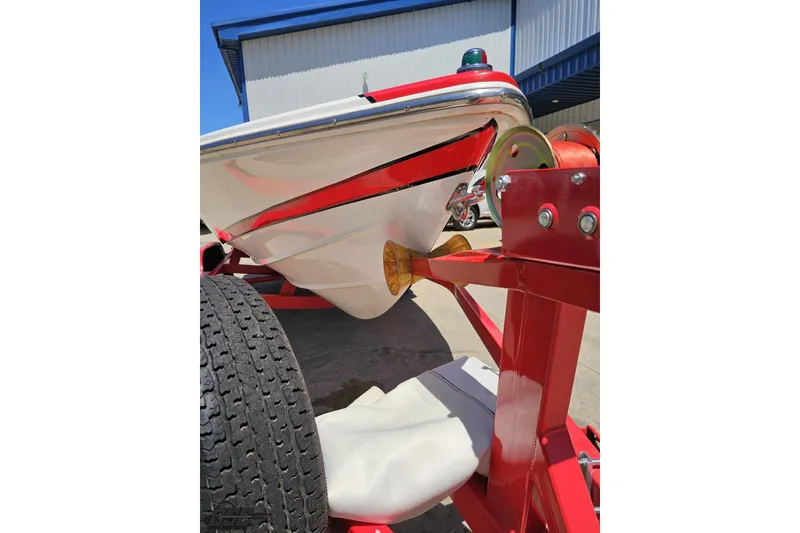Slide: The Image of 1997 Donzi 18 Classic boat on red trailer, close-up view. - 24