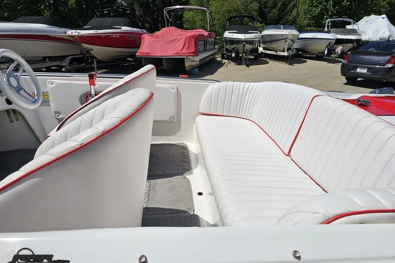 Slide: The Image of Interior of a 1997 Donzi 18 Classic boat with white and red-trimmed seating. - 34
