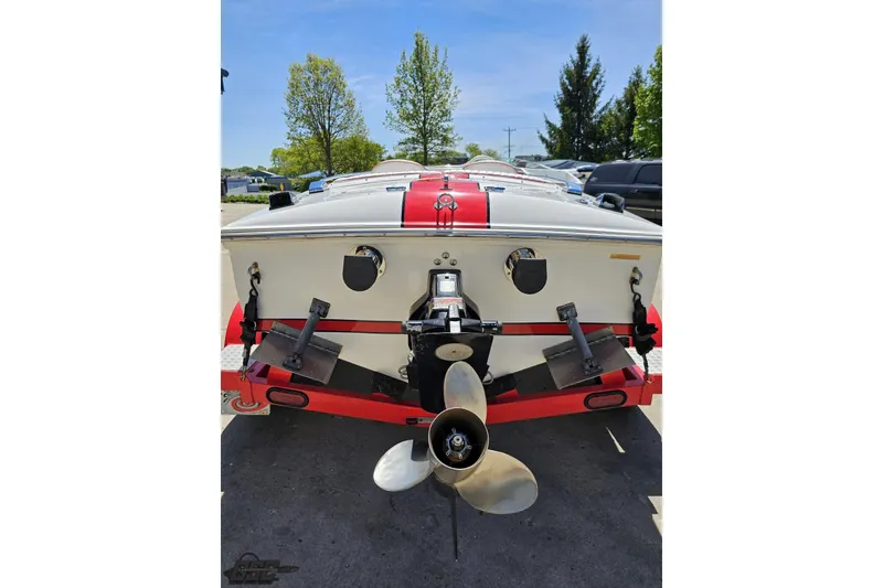 Slide: The Image of Rear view of a 1997 Donzi 18 Classic boat with red and white detailing. - 47