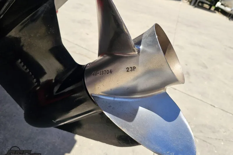 Slide: The Image of Close-up of a 1997 Donzi 18 Classic boat propeller with model number 48-13704. - 49