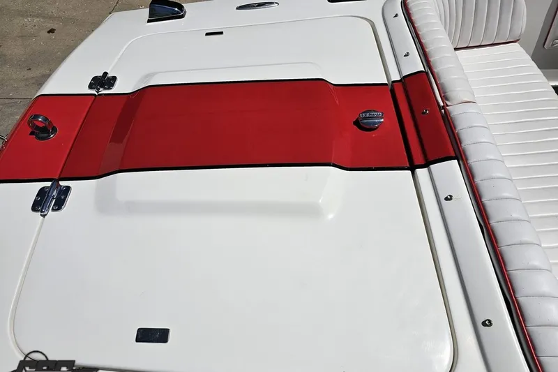 Slide: The Image of 1997 Donzi 18 Classic boat with red and white deck and seating. - 53