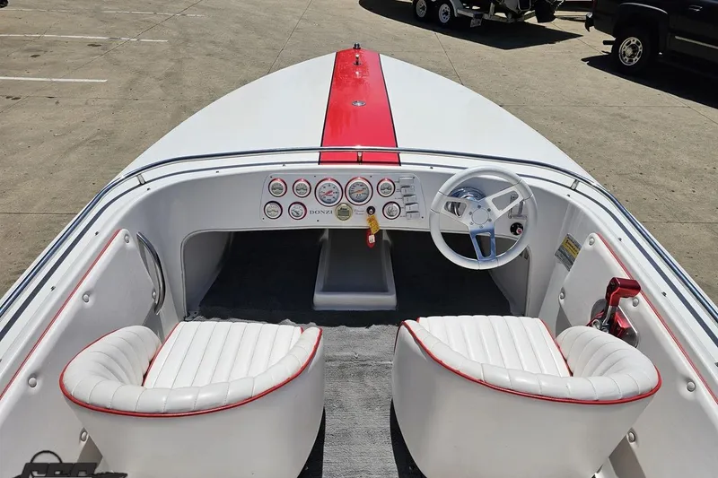 Slide: The Image of 1997 Donzi 18 Classic boat interior with white seats and red accents. - 58