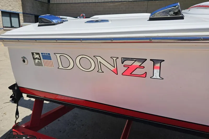 Slide: The Image of 1997 Donzi 18 Classic boat with logo and USA flag emblem. - 6