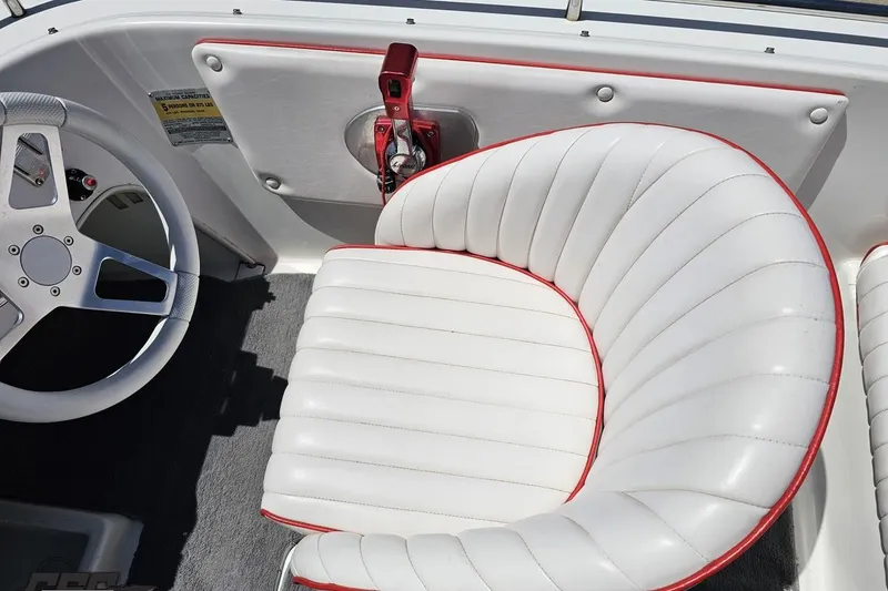Slide: The Image of Interior of a 1997 Donzi 18 Classic boat with white and red seating. - 60