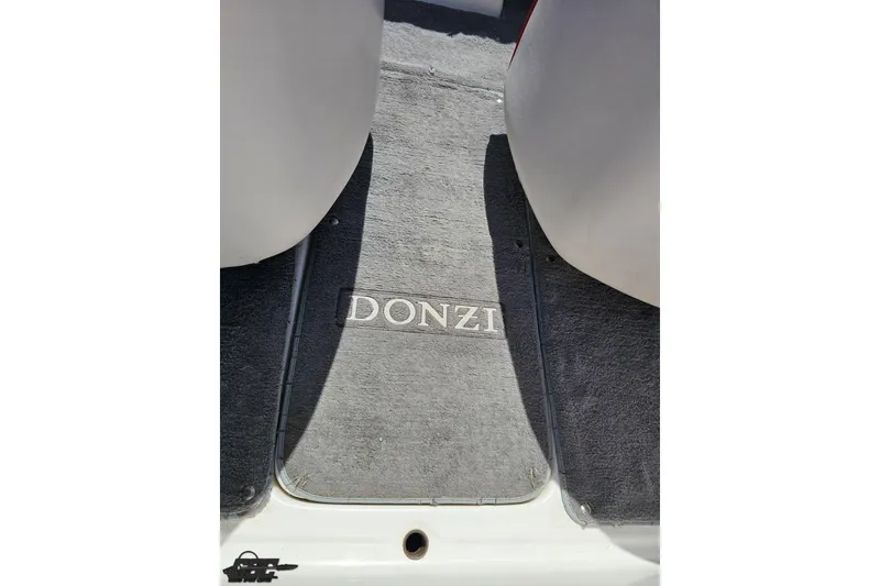 Slide: The Image of 1997 Donzi 18 Classic boat interior with branded carpet flooring. - 62