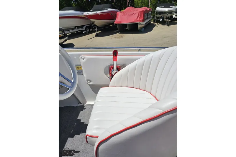 Slide: The Image of 1997 Donzi 18 Classic boat interior with white and red-trimmed seating. - 67