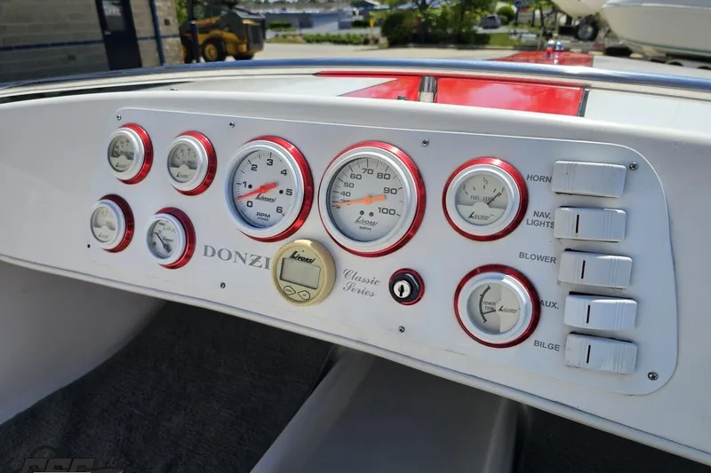 Slide: The Image of Dashboard of a 1997 Donzi 18 Classic boat with Livorsi gauges and switches. - 69