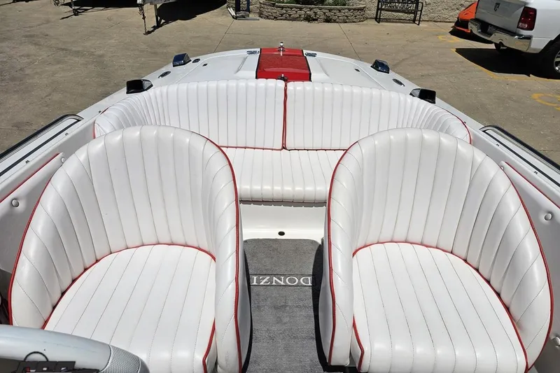 Slide: The Image of 1997 Donzi 18 Classic boat interior with white and red-trimmed seating. - 74