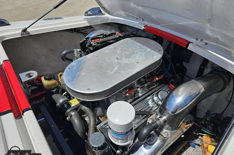 Slide: The Image of Engine compartment of a 1997 Donzi 18 Classic boat, showcasing detailed mechanical components. - 79
