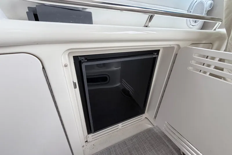 Slide: The Image of Compact refrigerator on a 2001 Sea Ray 380 Sundancer yacht, featuring sleek design and functionality. - 10