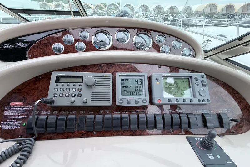 Slide: The Image of Control panel of a 2001 Sea Ray 380 Sundancer boat with navigation instruments. - 15