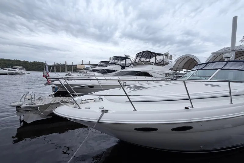 Slide: The Image of Docked 2001 Sea Ray 380 Sundancer yacht under cloudy skies. - 2