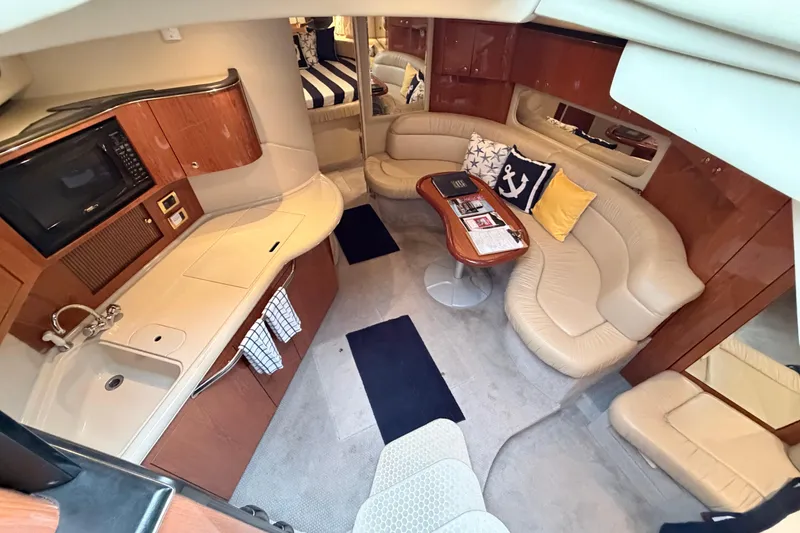 Slide: The Image of Luxurious interior of 2001 Sea Ray 380 Sundancer yacht with plush seating and kitchenette. - 20