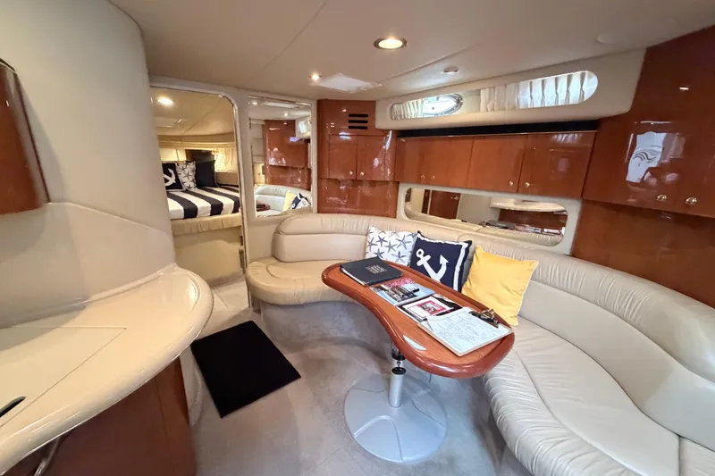 Slide: The Image of Luxurious interior of 2001 Sea Ray 380 Sundancer yacht with elegant seating and nautical decor. - 21