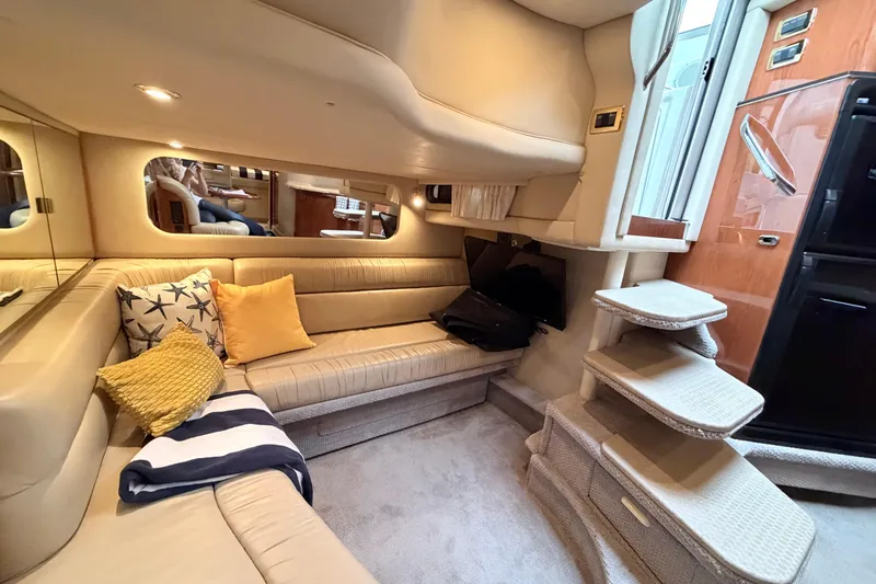 Slide: The Image of Luxurious interior of 2001 Sea Ray 380 Sundancer yacht with cozy seating and elegant decor. - 26