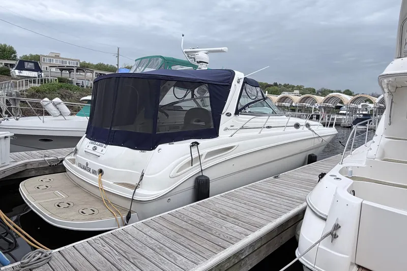 Slide: The Image of 2001 Sea Ray 380 Sundancer docked at marina under cloudy sky. - 3