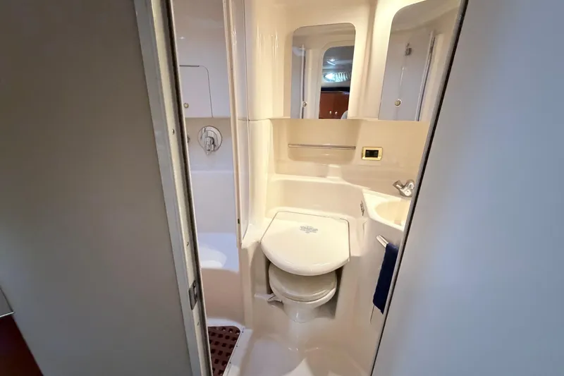 Slide: The Image of Bathroom interior of 2001 Sea Ray 380 Sundancer yacht, featuring compact design and amenities. - 33