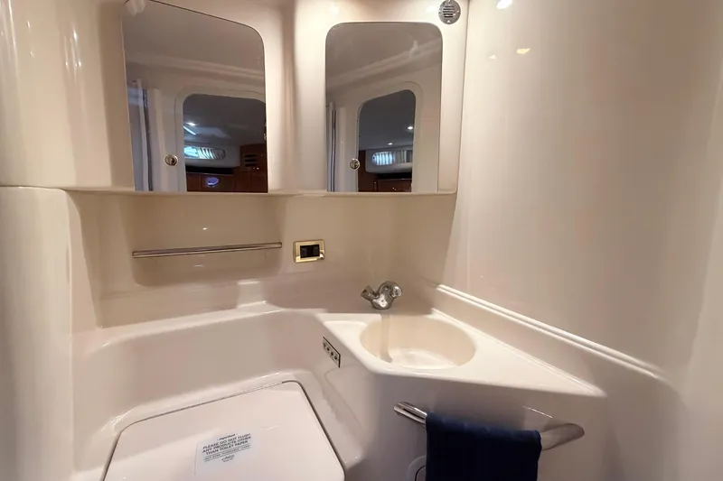 Slide: The Image of Bathroom interior of 2001 Sea Ray 380 Sundancer yacht, featuring sink and mirrors. - 35