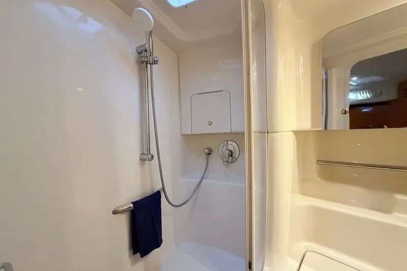 Slide: The Image of Bathroom interior of 2001 Sea Ray 380 Sundancer yacht, featuring shower and towel rack. - 36