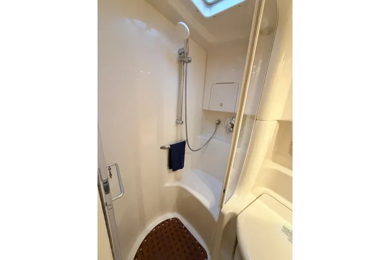 Slide: The Image of Shower area in 2001 Sea Ray 380 Sundancer yacht, featuring sleek design and modern fixtures. - 37