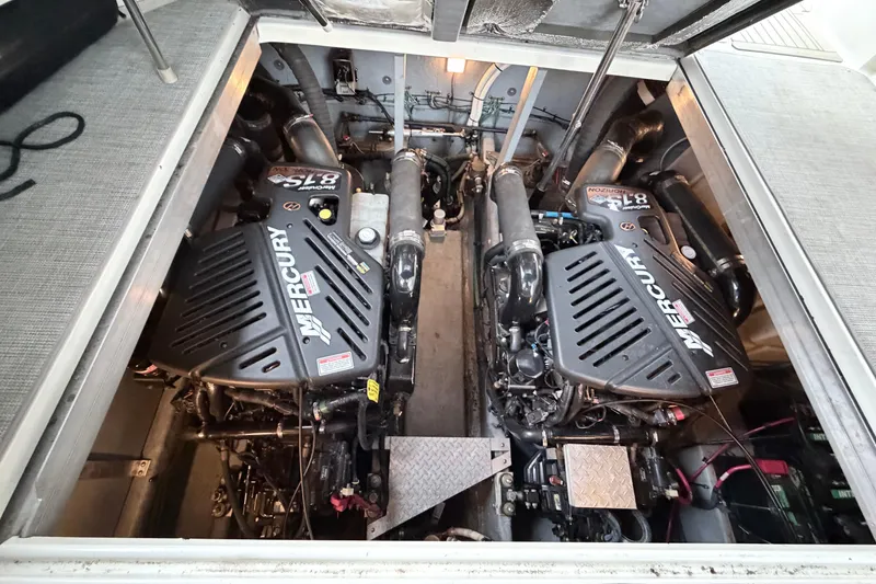 Slide: The Image of Engine compartment of a 2001 Sea Ray 380 Sundancer with twin Mercury engines. - 39
