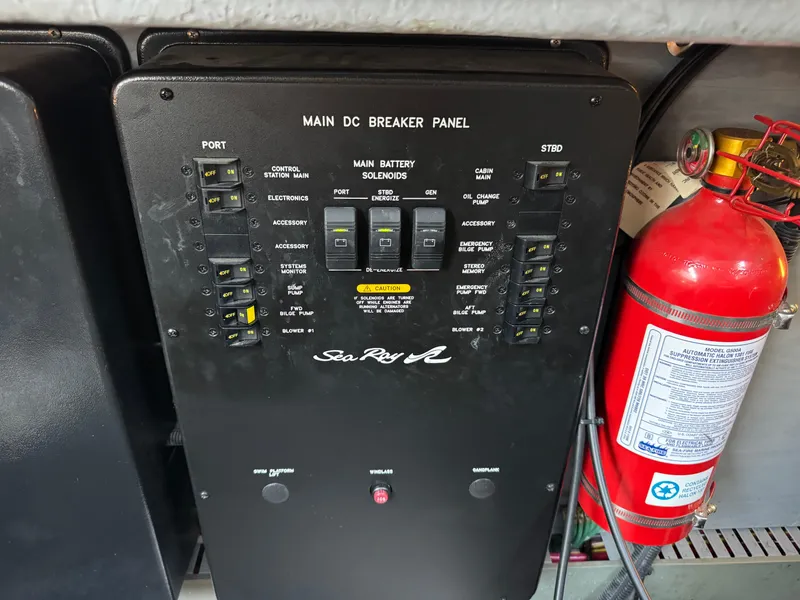 Slide: The Image of Main DC breaker panel of 2001 Sea Ray 380 Sundancer with fire extinguisher. - 40