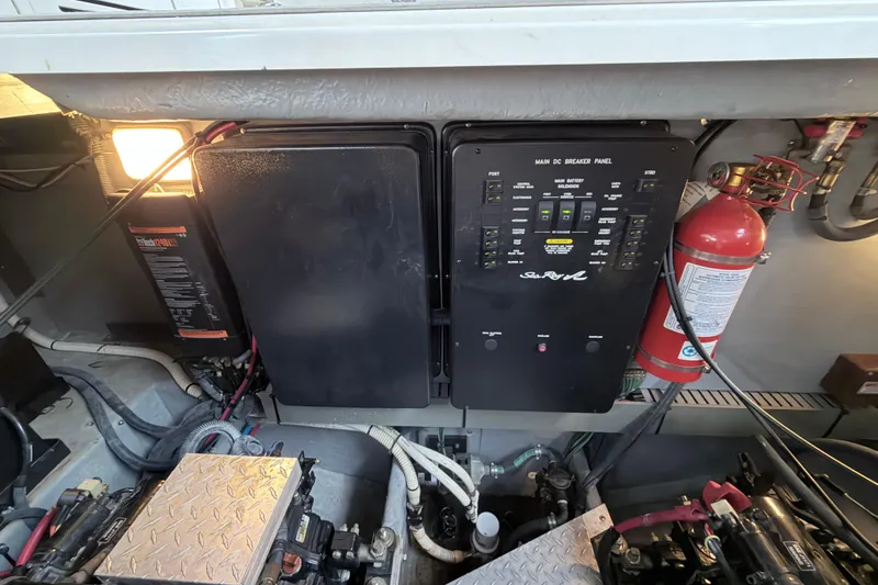 Slide: The Image of Engine room of 2001 Sea Ray 380 Sundancer with breaker panel and fire extinguisher. - 41