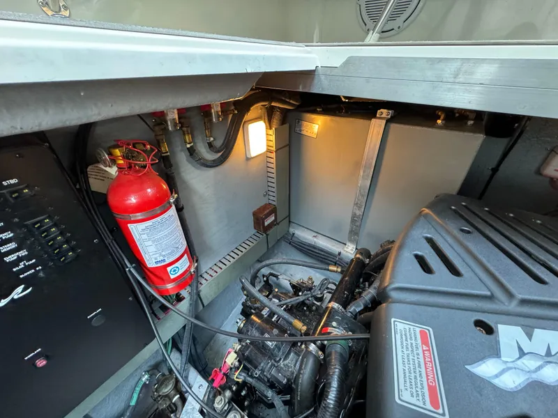 Slide: The Image of Engine room of 2001 Sea Ray 380 Sundancer with fire extinguisher. - 42