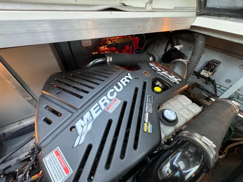 Slide: The Image of Engine compartment of 2001 Sea Ray 380 Sundancer with Mercury engine. - 44