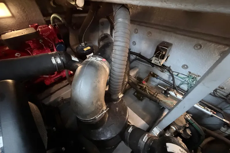 Slide: The Image of Engine room of a 2001 Sea Ray 380 Sundancer with visible components and wiring. - 49