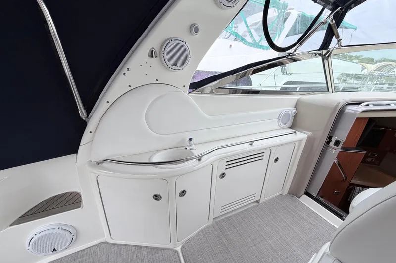 Slide: The Image of Interior view of 2001 Sea Ray 380 Sundancer yacht with sink and storage cabinets. - 9