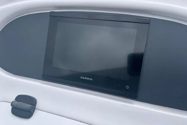 Slide: The Image of Garmin display on 2000 Donzi 33 ZX boat dashboard, featuring sleek design and modern technology. - 11