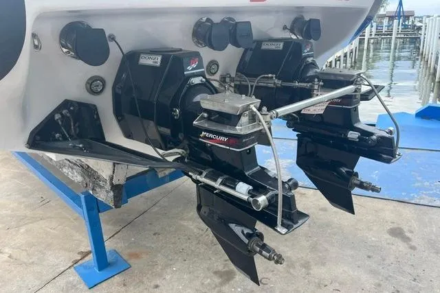 Slide: The Image of Rear view of a 2000 Donzi 33 ZX boat with Mercury outboard engines. - 3