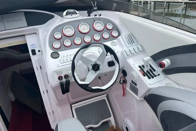 Slide: The Image of Cockpit of a 2000 Donzi 33 ZX boat with steering wheel and gauges. - 7