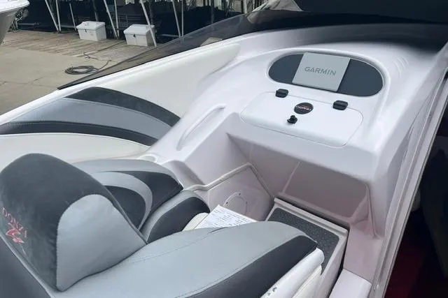 Slide: The Image of 2000 Donzi 33 ZX boat interior with Garmin navigation system and sleek seating. - 8