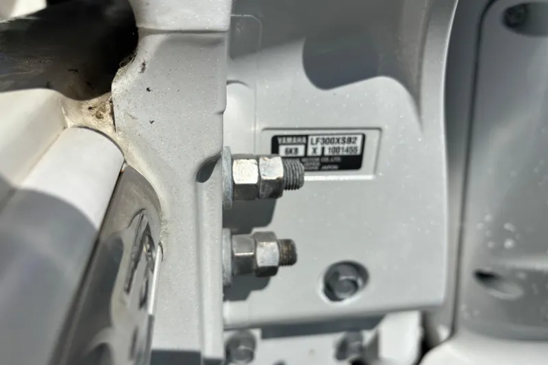 Slide: The Image of Close-up of a 2023 Cobia 301 Center Console boat engine details. - 17