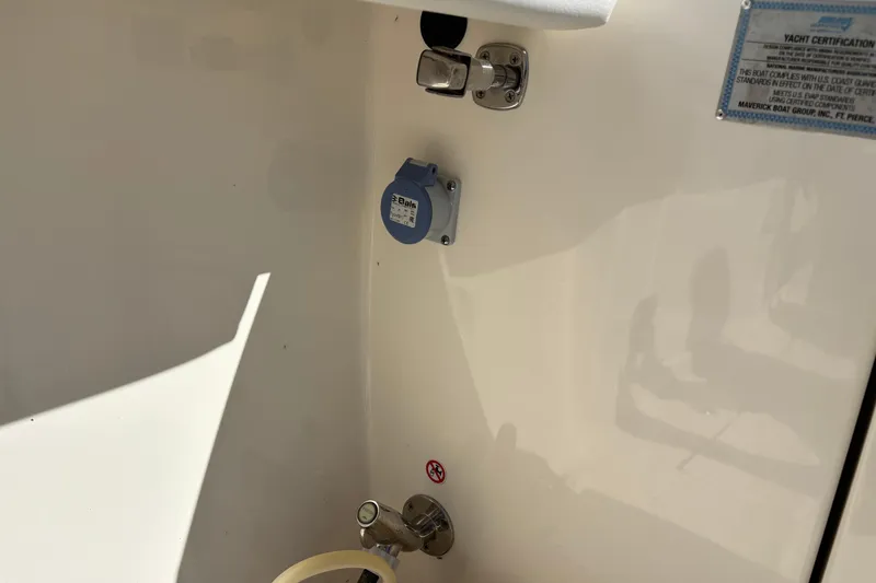 Slide: The Image of 2023 Cobia 301 Center Console yacht certification and utility connections. - 19