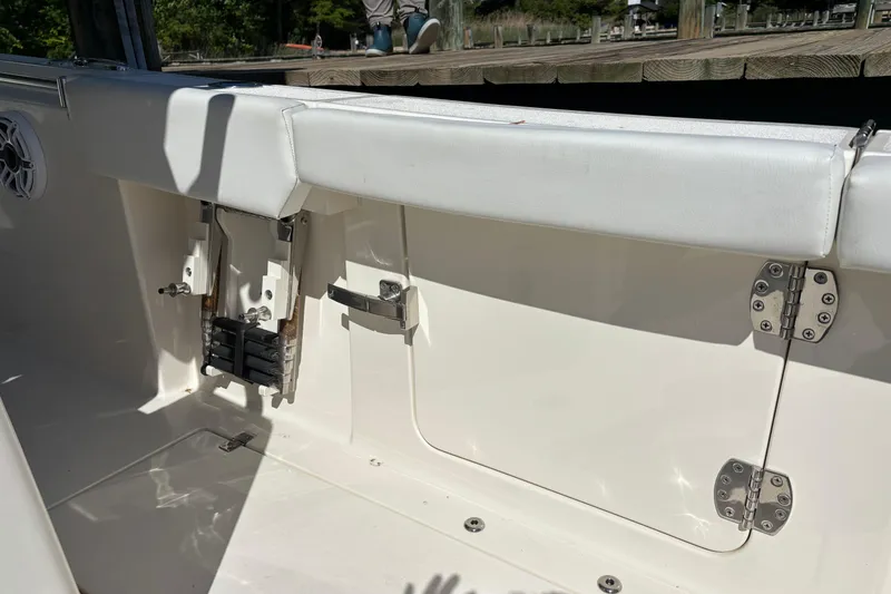 Slide: The Image of 2023 Cobia 301 Center Console boat interior with seating and hardware details. - 26