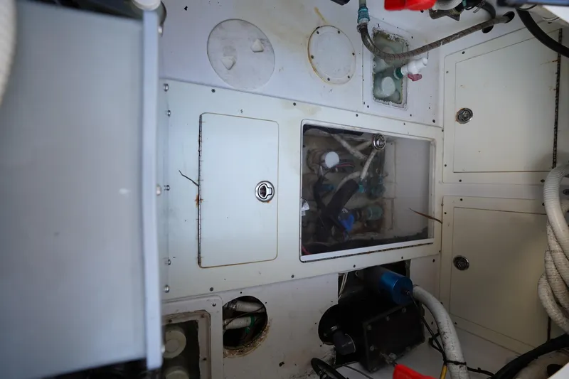 Slide: The Image of Engine compartment of a 2014 SeaHunter 45 Tournament boat, showing mechanical components and wiring. - 11